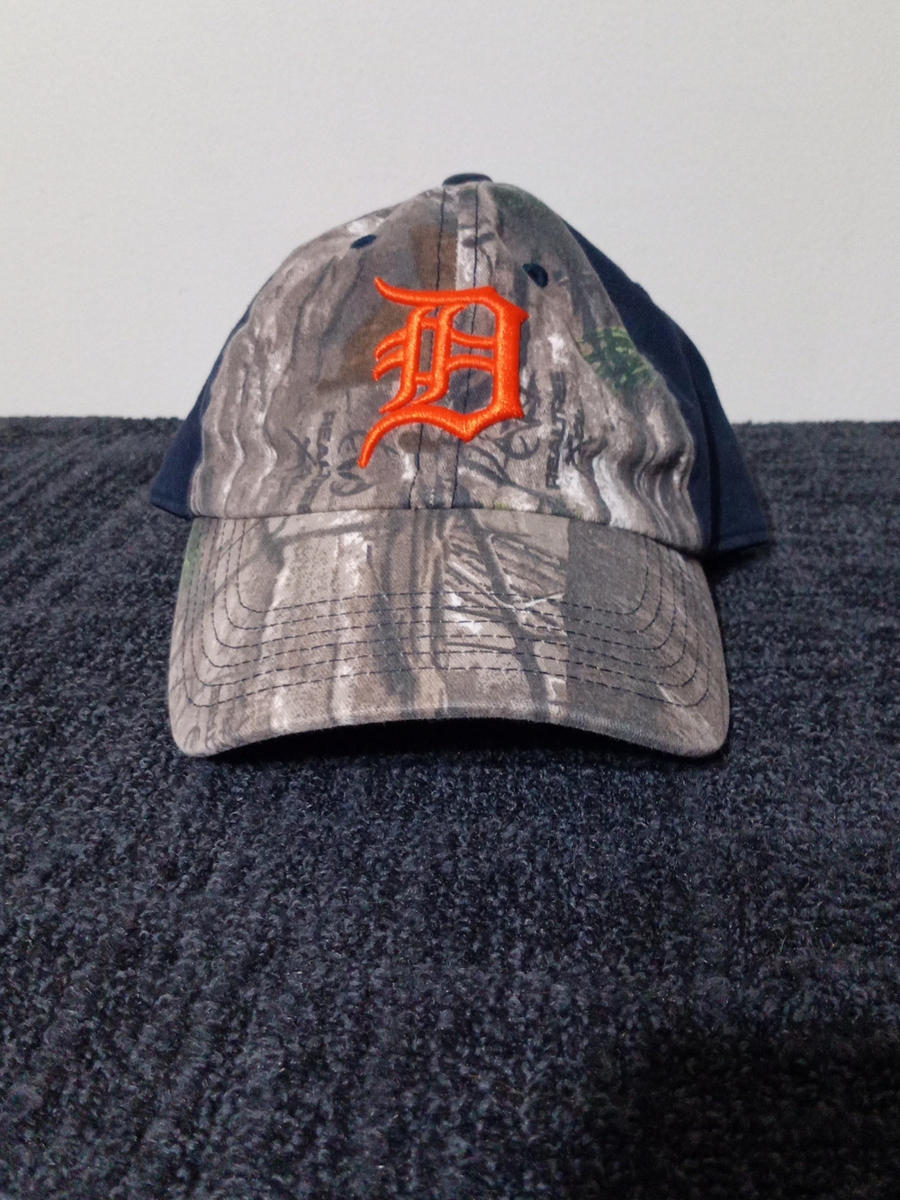 Genuine Merchandise Realtree Camo Baseball Cap with Orange 'D' Logo